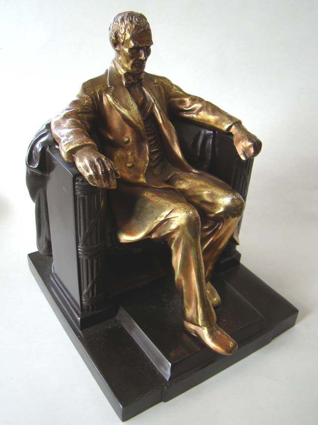 A pair of Abraham Lincoln 'sitting in the chair' bookends by the Philadelphia Manufacturing Company circa 1935 — image 3